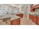 Kitchen with breakfast bar featuring granite counters, cherry cabinets and hardwood floors at 3451 Falls Branch Ct, Buford, GA 30519