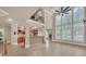 Great room featuring large windows, wood floors and a fireplace at 3451 Falls Branch Ct, Buford, GA 30519