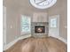 Bright living room features a fireplace and hardwood flooring at 3451 Falls Branch Ct, Buford, GA 30519