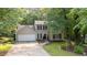 Charming two-story home with a manicured lawn and attached two-car garage at 5679 Bay Harbor Nw Trl, Acworth, GA 30101