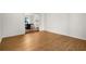 Open-concept living room with hardwood floors and view of dining area at 5679 Bay Harbor Nw Trl, Acworth, GA 30101