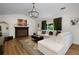 Inviting living room featuring a fireplace, hardwood floors, and ample seating at 5679 Bay Harbor Nw Trl, Acworth, GA 30101