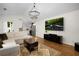 Spacious living room leading to kitchen, hardwood floors, and neutral color scheme at 5679 Bay Harbor Nw Trl, Acworth, GA 30101