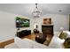 Inviting living room featuring a fireplace, stylish chandelier, and contemporary decor, creating a comfortable atmosphere at 5679 Bay Harbor Nw Trl, Acworth, GA 30101