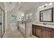 Large bathroom with soaking tub, granite counters, and a tiled tub surround at 1231 Fawndale Nw Dr, Kennesaw, GA 30152