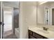 Bathroom with brown vanity, white sink and mirror at 1231 Fawndale Nw Dr, Kennesaw, GA 30152