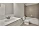 Clean bathroom with a white vanity, a bathtub with gray tiling, and fixtures in chrome at 1231 Fawndale Nw Dr, Kennesaw, GA 30152