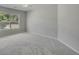 Bedroom with gray carpet, a window, and base molding at 1231 Fawndale Nw Dr, Kennesaw, GA 30152