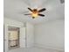 Bedroom with ceiling fan and view into other room at 1231 Fawndale Nw Dr, Kennesaw, GA 30152