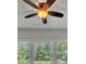 View of ceiling fan with window and tree background at 1231 Fawndale Nw Dr, Kennesaw, GA 30152