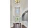 Bright foyer with soaring ceilings, hardwood floors, and elegant chandelier, creating a grand entrance at 1231 Fawndale Nw Dr, Kennesaw, GA 30152