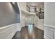 Open foyer with dark hardwood floors, staircase, and stylish trim, providing a welcoming atmosphere at 1231 Fawndale Nw Dr, Kennesaw, GA 30152