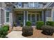 Inviting entrance with gray trim and a well-kept garden enhances the home's curb appeal at 1231 Fawndale Nw Dr, Kennesaw, GA 30152
