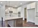 Modern kitchen with large island, granite countertops, stainless steel appliances, and ample cabinet space at 1231 Fawndale Nw Dr, Kennesaw, GA 30152