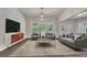 Bright living room showcasing shiplap wall, modern furniture, large windows, and elegant decor at 1231 Fawndale Nw Dr, Kennesaw, GA 30152