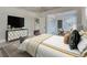Serene main bedroom with stylish decor, a large window, and access to a sitting area at 1231 Fawndale Nw Dr, Kennesaw, GA 30152
