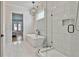 Modern bathroom featuring a freestanding tub, glass enclosed shower, and stylish fixtures at 175 Central Ave, Fayetteville, GA 30214