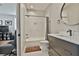 Bathroom with a shower-tub combination, vanity, and hexagon tile flooring at 175 Central Ave, Fayetteville, GA 30214
