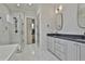 Modern bathroom featuring a glass-enclosed shower and double vanity at 175 Central Ave, Fayetteville, GA 30214