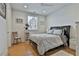 Bright bedroom with natural light, hardwood floors, and a comfortable bed at 175 Central Ave, Fayetteville, GA 30214