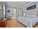Bright and airy main bedroom with hardwood floors and ensuite bathroom at 175 Central Ave, Fayetteville, GA 30214