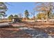 Picturesque view of a community gathering space with mature trees and picnic tables at 175 Central Ave, Fayetteville, GA 30214