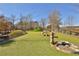 Community dog park featuring lush green space with play features and a fire hydrant at 175 Central Ave, Fayetteville, GA 30214
