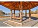 Scenic lake view with lovely wooden gazebo featuring multiple benches at 175 Central Ave, Fayetteville, GA 30214