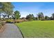 Expansive green space with a charming gravel pathway and scenic landscaping at 175 Central Ave, Fayetteville, GA 30214