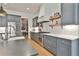 Stylish kitchen featuring stainless steel appliances, quartz countertops, and open shelving at 175 Central Ave, Fayetteville, GA 30214