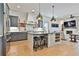 Modern kitchen featuring an island with seating and stainless steel appliances at 175 Central Ave, Fayetteville, GA 30214