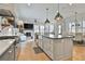 Bright kitchen with an island and farmhouse sink and open floorplan at 175 Central Ave, Fayetteville, GA 30214