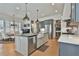 Updated kitchen with stainless appliances, a center island, and open to the dining area at 175 Central Ave, Fayetteville, GA 30214