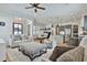Open-concept living room flows to the kitchen, with hardwood floors and stylish decor at 175 Central Ave, Fayetteville, GA 30214