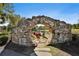 Unique stone structure overlooking a pond with outdoor seating, a peaceful retreat at 175 Central Ave, Fayetteville, GA 30214