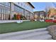 Modern outdoor space with artificial turf, stylish seating, and contemporary design features at 175 Central Ave, Fayetteville, GA 30214