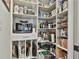 Organized walk-in pantry featuring shelving for food and cookware storage at 175 Central Ave, Fayetteville, GA 30214