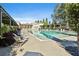 Tranquil swimming pool surrounded by lush landscaping and comfortable lounge chairs at 175 Central Ave, Fayetteville, GA 30214