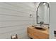 Stylish powder room featuring shiplap walls and a unique vessel sink at 175 Central Ave, Fayetteville, GA 30214