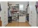Organized walk-in closet features custom shelving and drawers for clothing and accessories at 175 Central Ave, Fayetteville, GA 30214