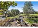 Picturesque community stream with rock accents, bridge, and lush landscaping at 175 Central Ave, Fayetteville, GA 30214