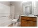 Bathroom featuring a bathtub, shower, and vanity with plenty of storage at 3694 Rolling Pl, Conley, GA 30288
