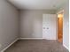 Cozy bedroom featuring a neutral color palette and plush carpet flooring at 3694 Rolling Pl, Conley, GA 30288