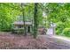 Charming two-story home with a brick and siding exterior and a well-maintained lawn surrounded by mature trees at 3694 Rolling Pl, Conley, GA 30288