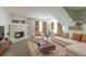 Cozy living room features a decorative brick fireplace and plush seating at 3694 Rolling Pl, Conley, GA 30288