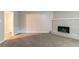Spacious living room featuring a fireplace and neutral carpet at 3694 Rolling Pl, Conley, GA 30288