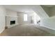 Living room featuring a fireplace, stairwell and neutral carpet at 3694 Rolling Pl, Conley, GA 30288