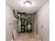 Utility room containing a hot water heater, furnace and storage shelves at 3694 Rolling Pl, Conley, GA 30288
