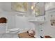 Powder room with a pedestal sink and white wainscoting at 4084 Peachtree Dunwoody Rd, Atlanta, GA 30342