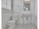Classic bathroom with stand alone sink, chrome fixtures, and white tile at 4084 Peachtree Dunwoody Rd, Atlanta, GA 30342